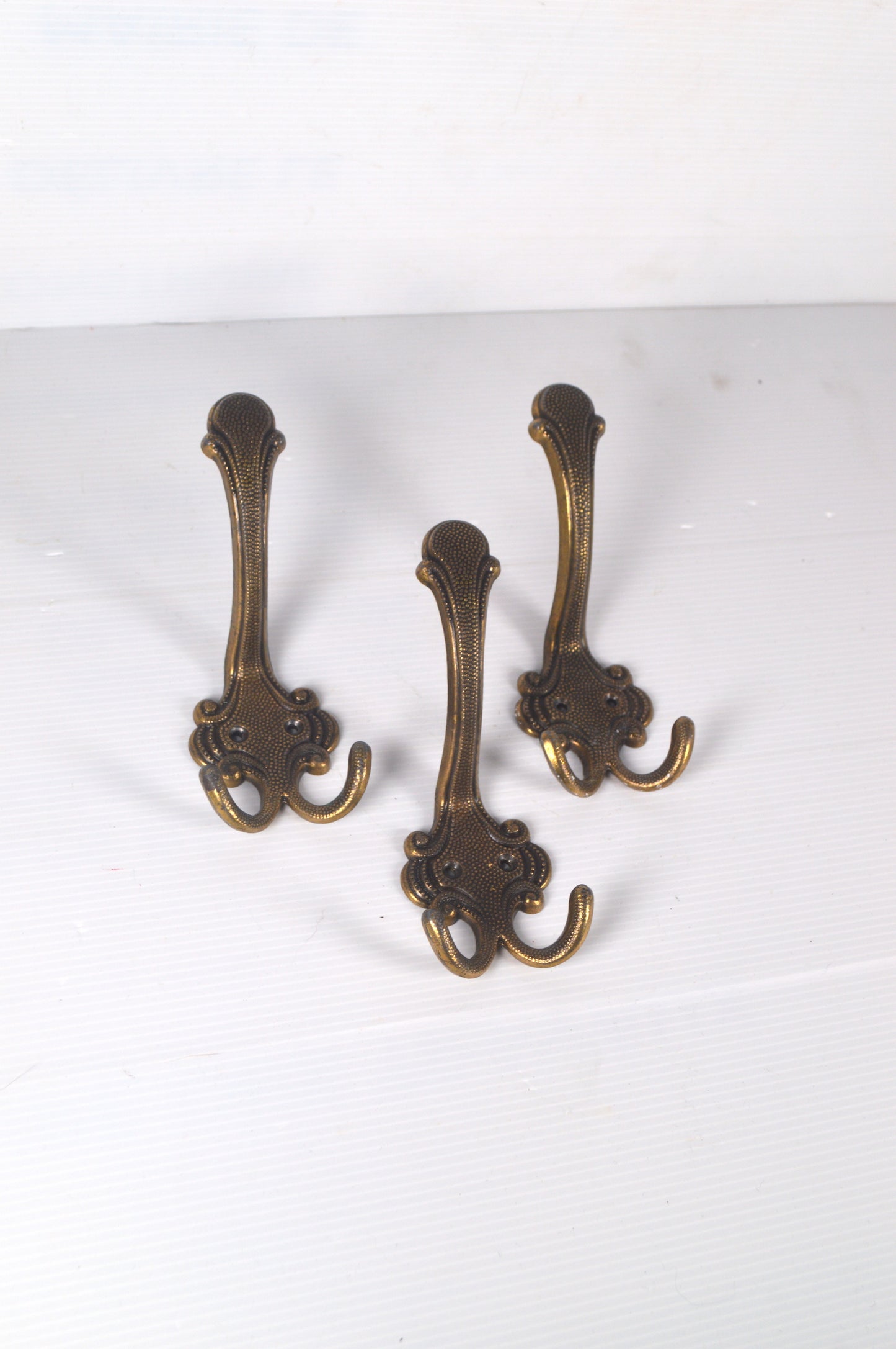 Trio de patères en laiton