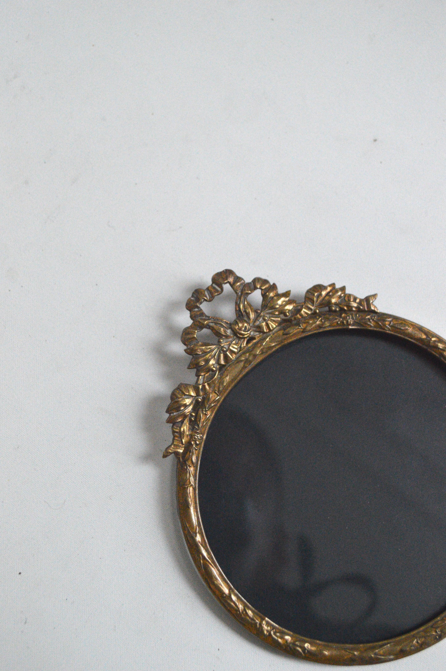 Petit cadre rond doré