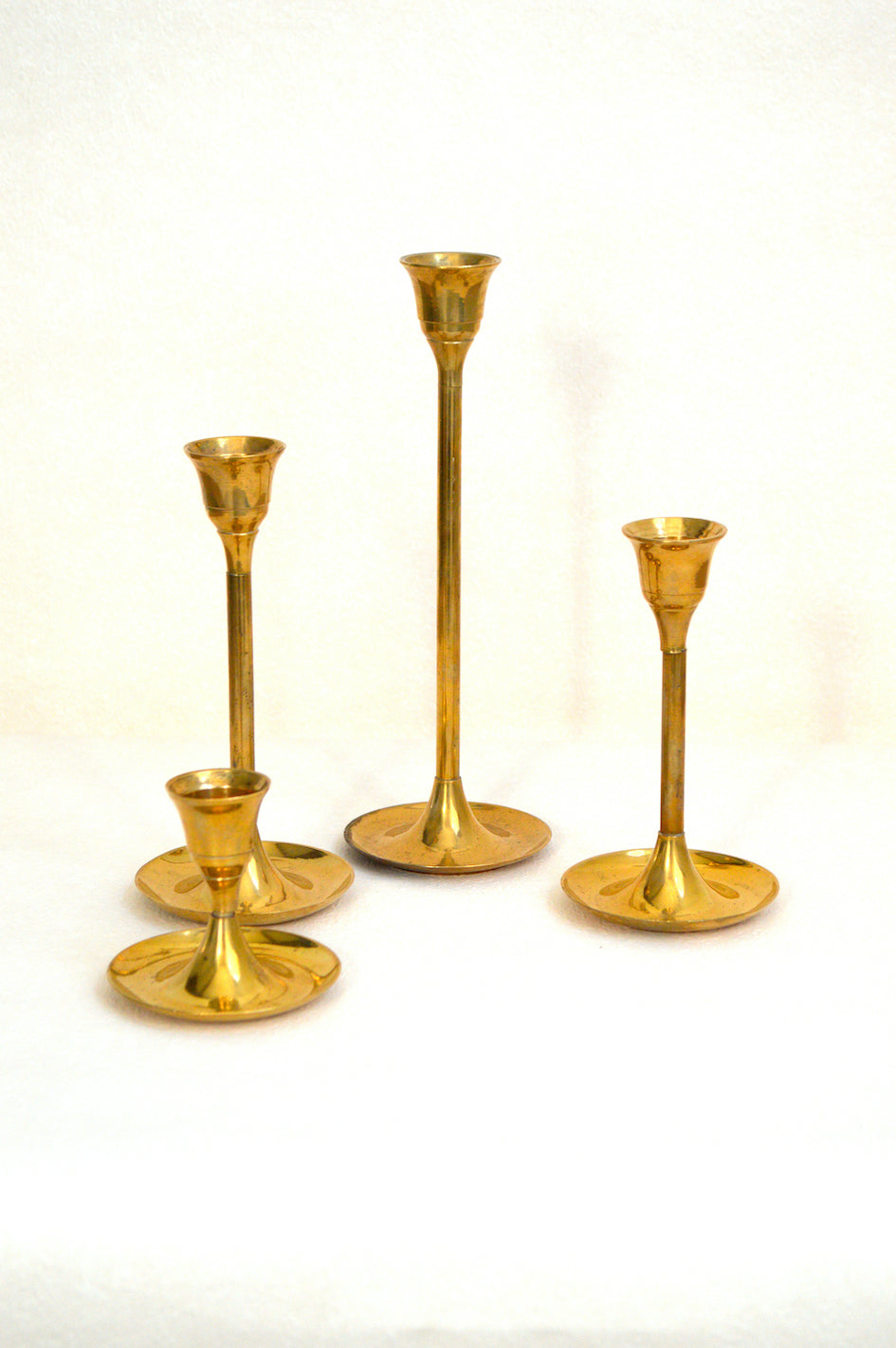 Ensemble de 4 bougeoirs en laiton