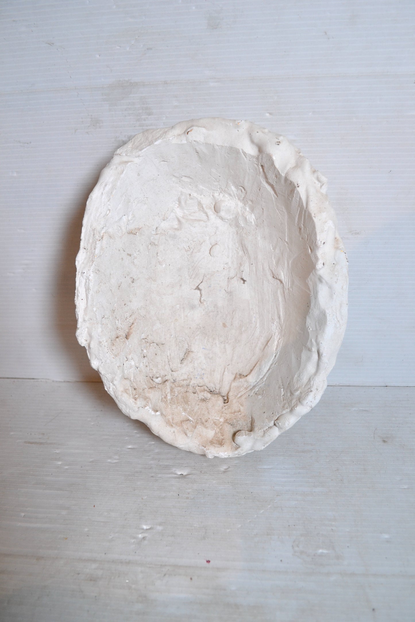 Visage en plâtre à suspendre