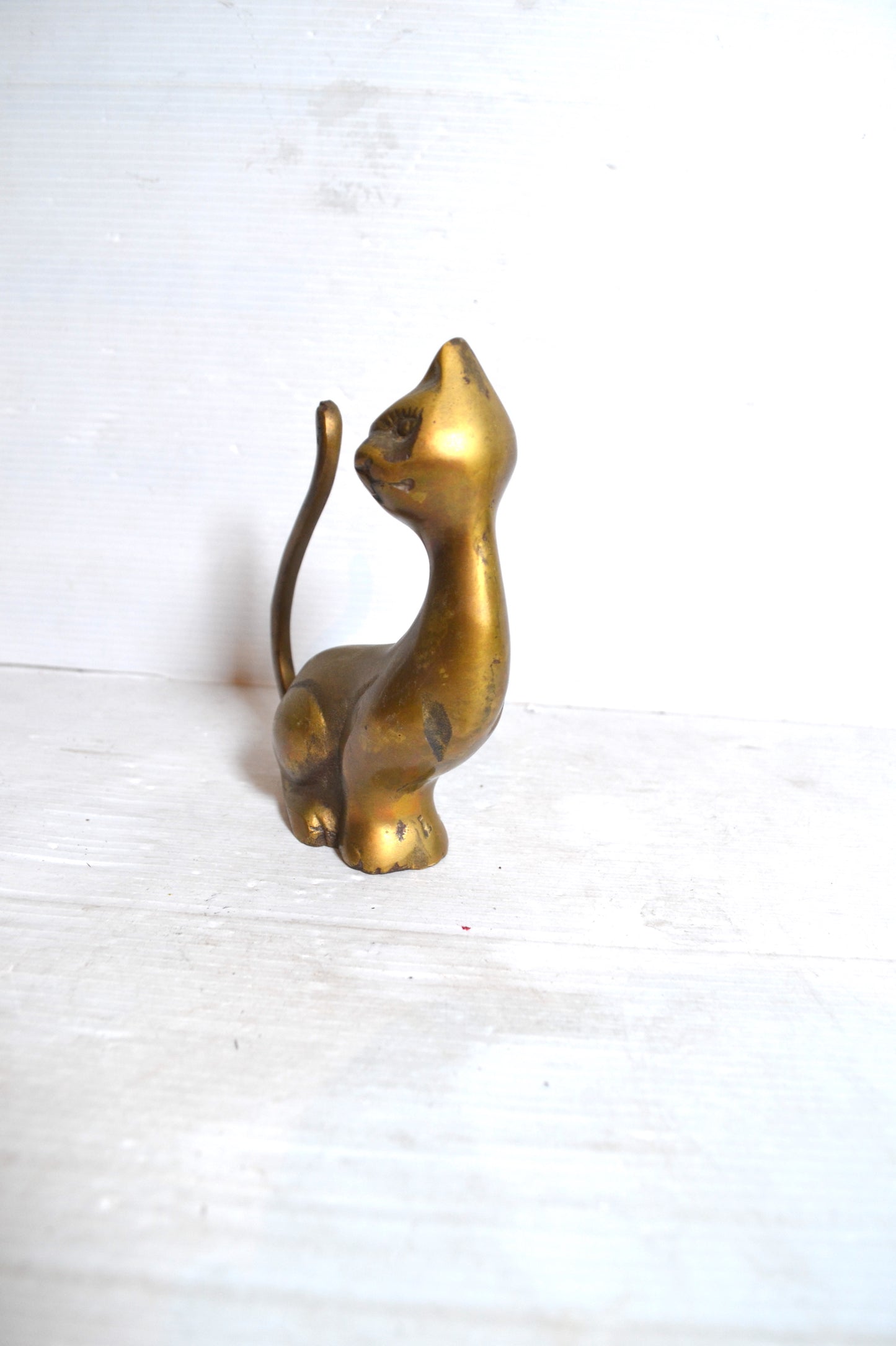 Chat en laiton