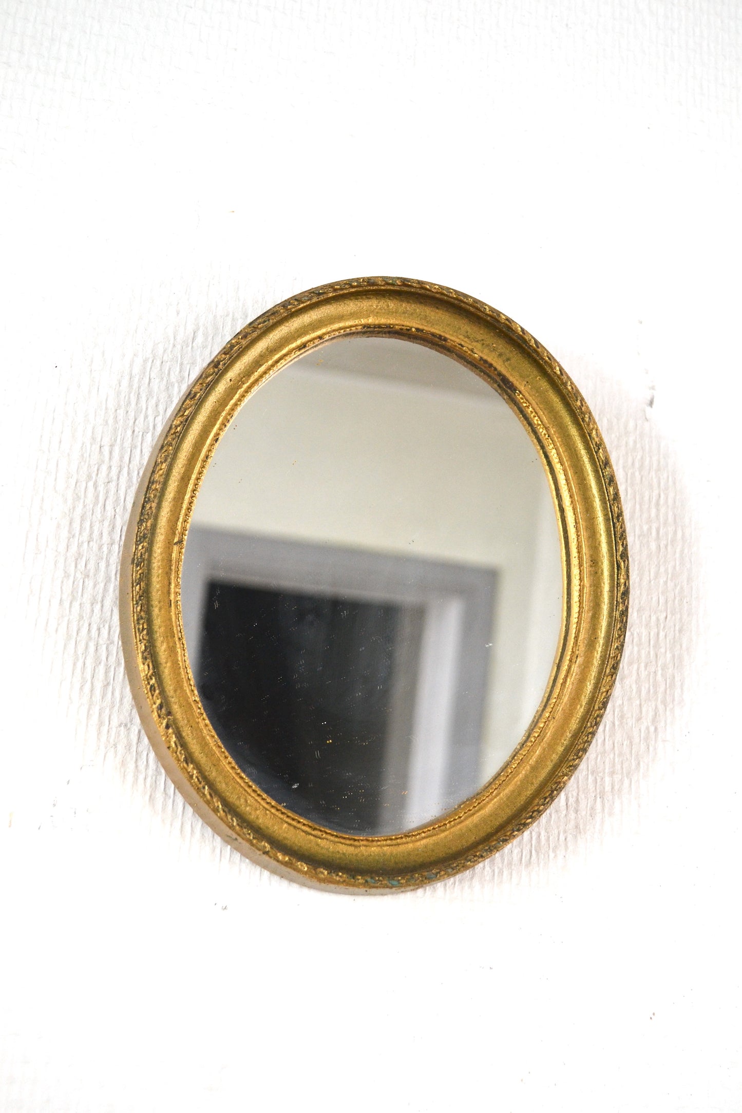 Miroir ovale doré