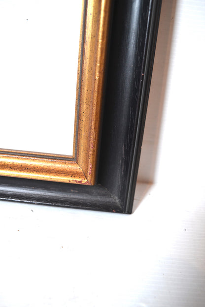 Cadre en bois noir et doré