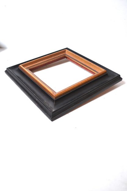 Cadre en bois noir et doré