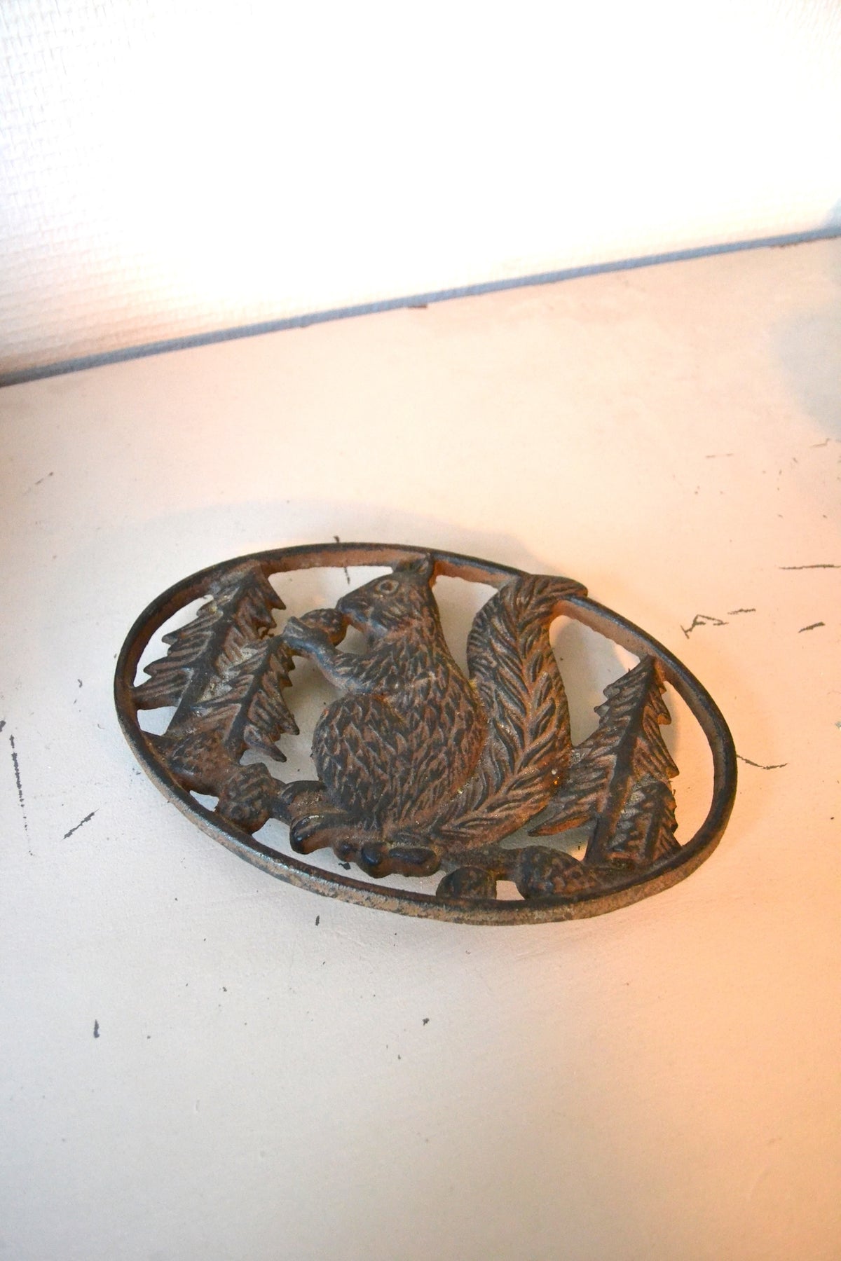 Dessous de plat en fonte