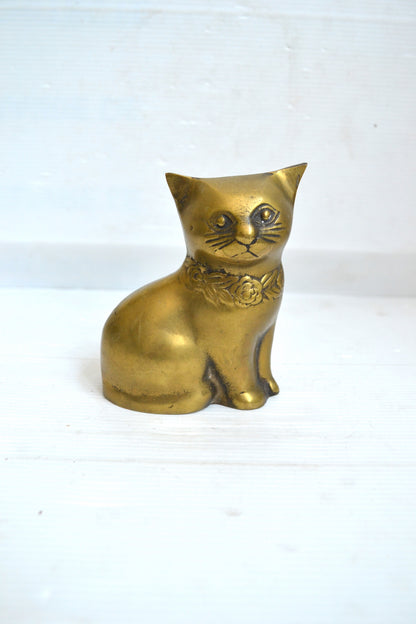 Chat en laiton