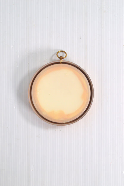 Petit cadre rond doré vide