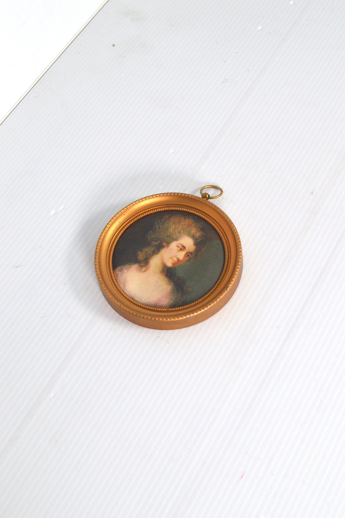 Petit cadre rond doré